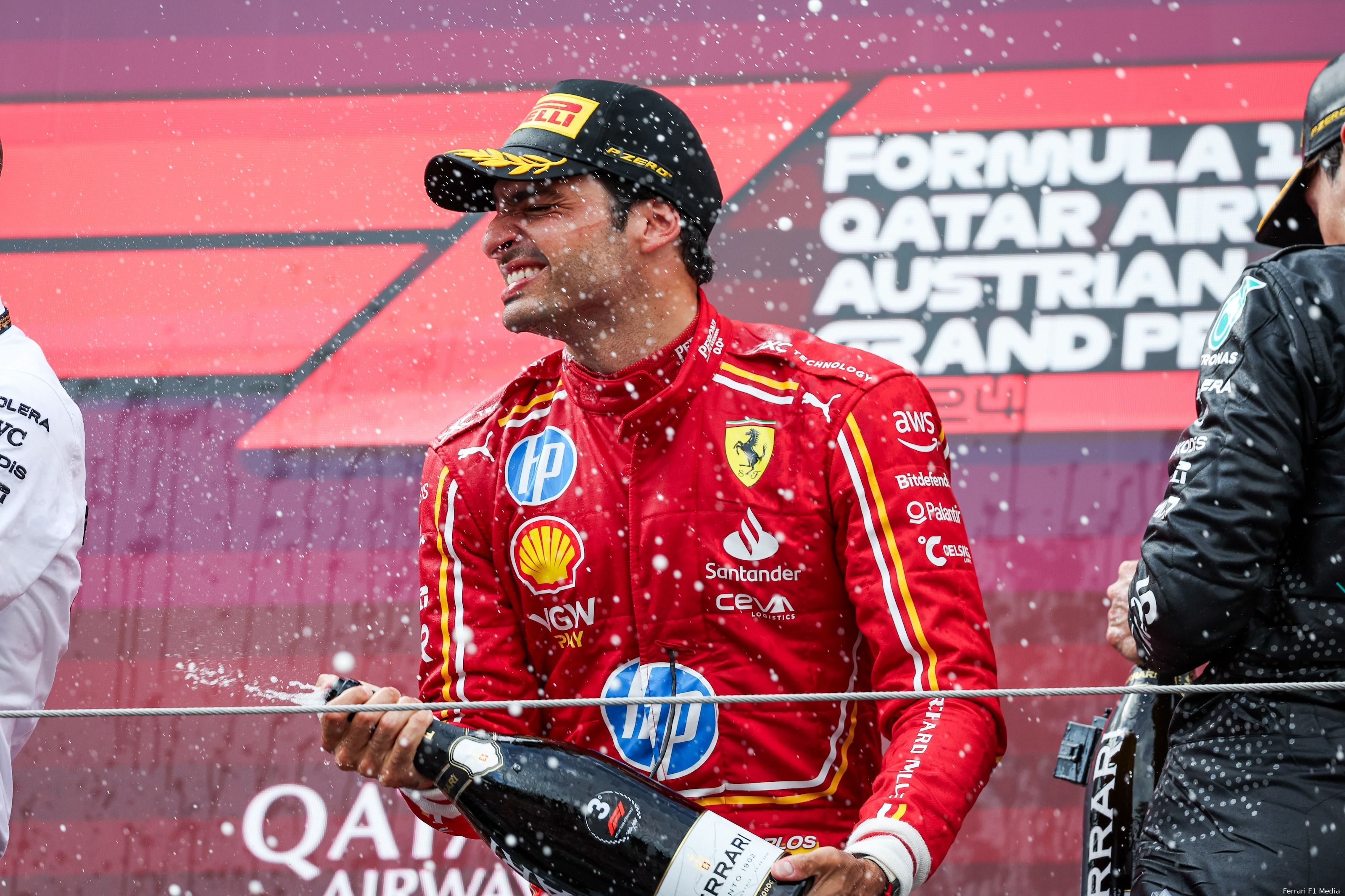 Carlos Sainz celebrating the P3 finish on the podium after the 2024 Austrian Grand Prix