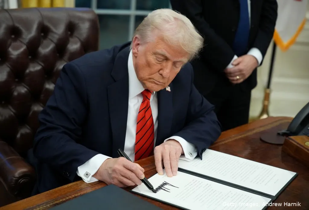 us-president-donald-trump-signs-a-series-of-executive-orders-in-the-oval-office-at-the-white-house-on-february-10-2025-in-washington-dc