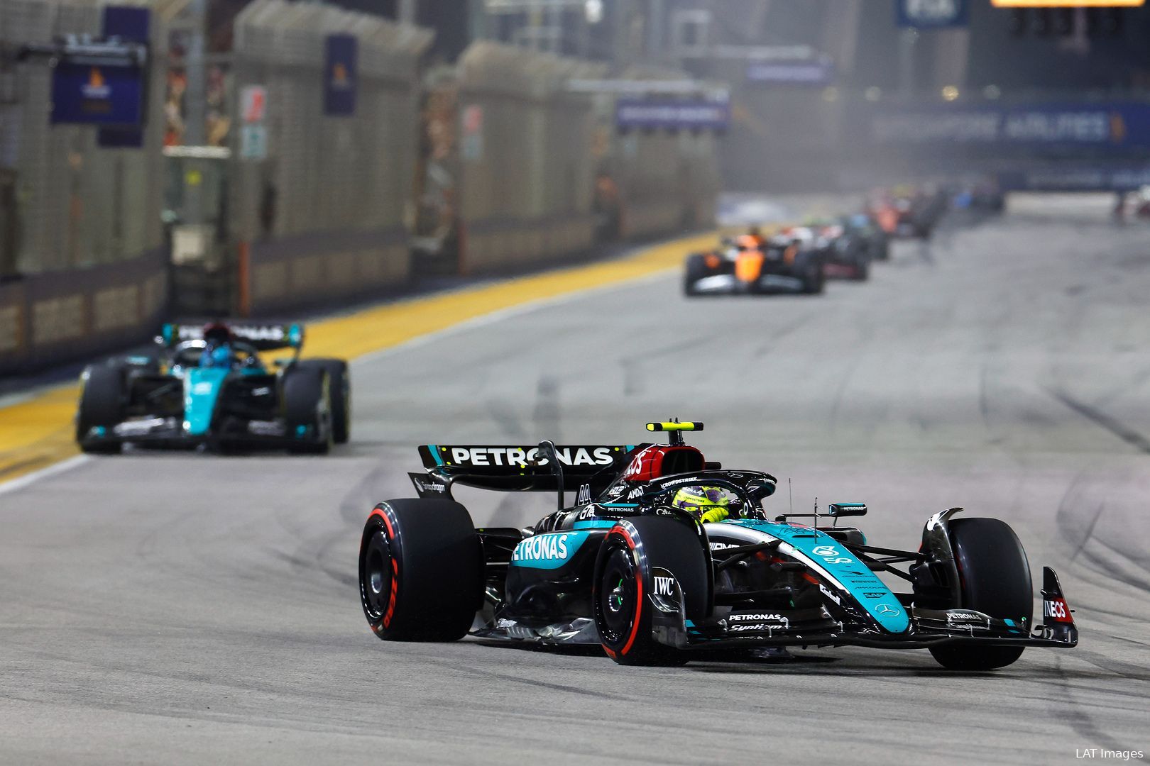 Lewis Hamilton, followed by George Russell, into turn 1 in the opening laps of the 2024 Singapore Grand Prix