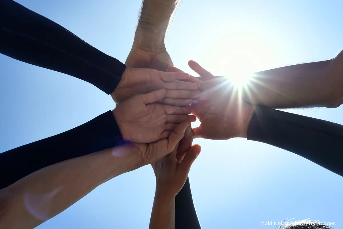 Close up of people holding hands
