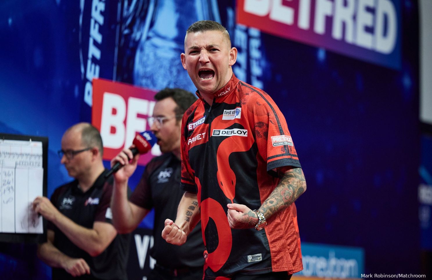 "I shouldn't really be playing... but I want to defend my title" - Nathan Aspinall battles through pain barrier to make winning start to World Matchplay defence