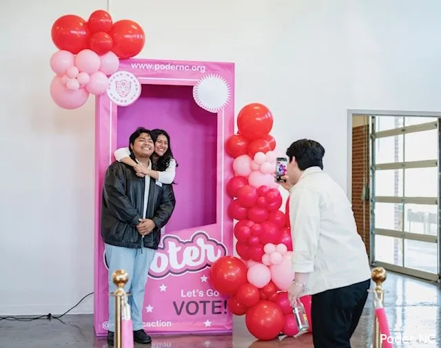 People posing in a photo booth