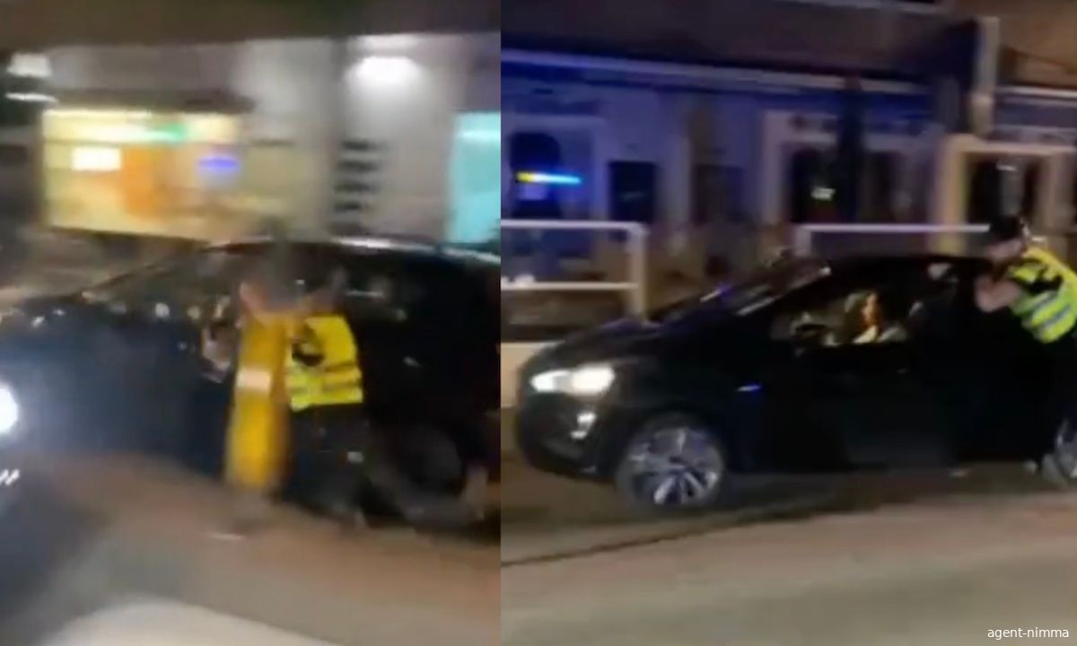 Agent in Nijmegen meters meegesleurd met auto