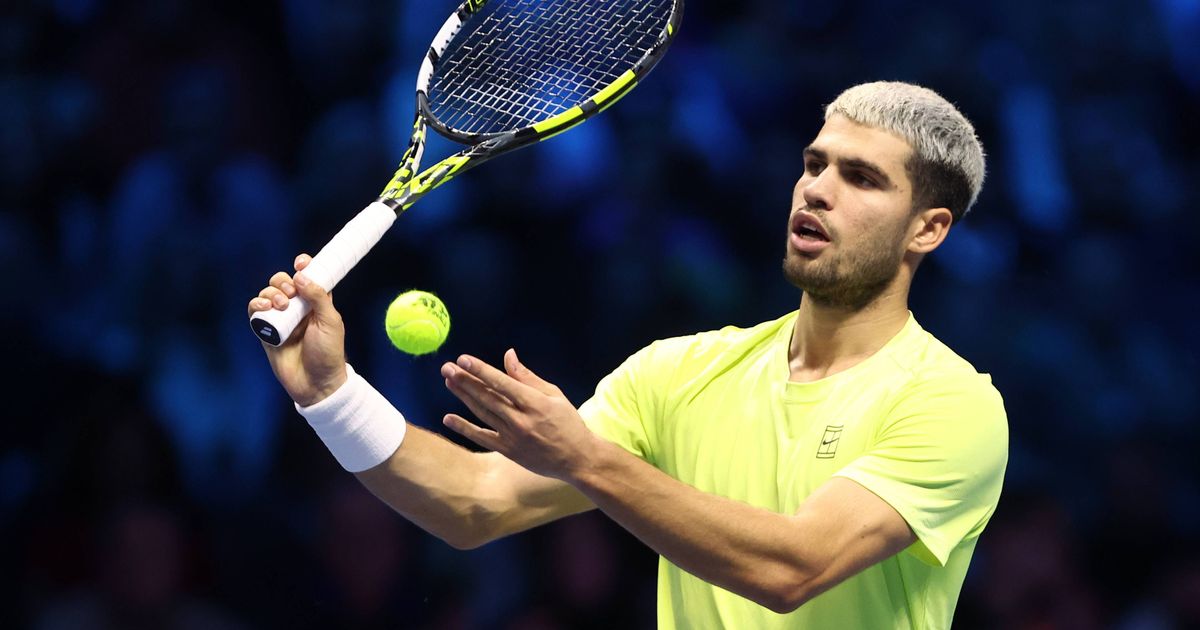 Carlos Alcaraz on a tennis court.