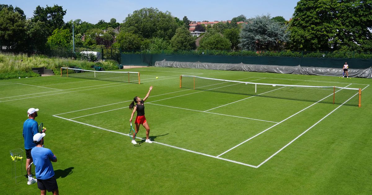 A grass tennis court set up for practice ahead of a Grand Slam tournament.