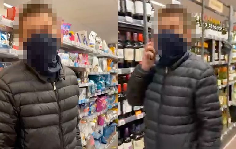 Agent in burger houdt mondkapjesweigeraar aan in supermarkt