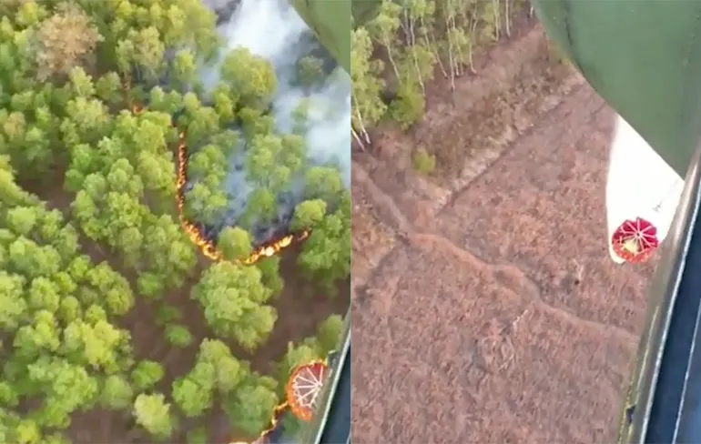 Beeld vanuit Chinook die helpt natuurbrand Deurnese Peel te blussen