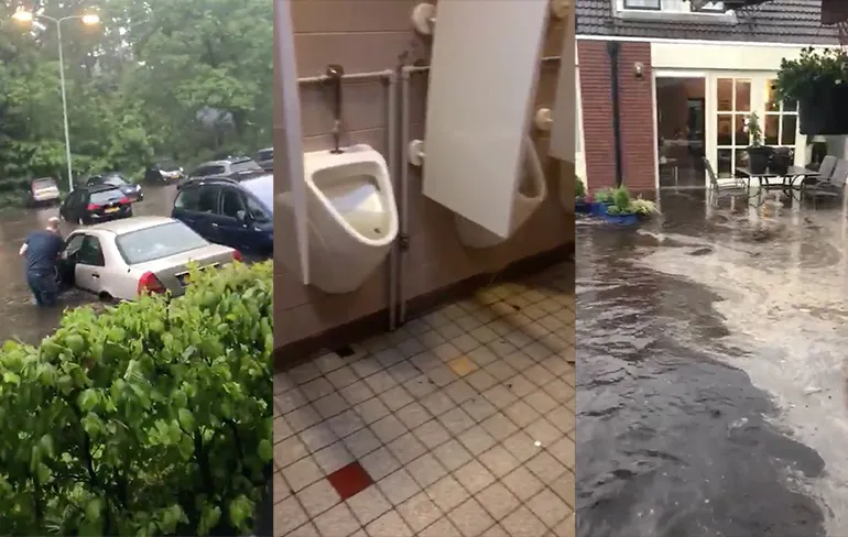 Beeld zware regenbuien veroorzaken wateroverlast in Noorden van Nederland