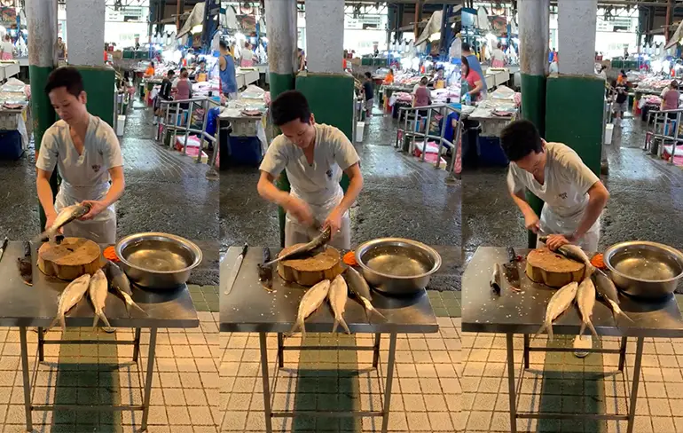 Beetje wrotten met een mes en chef heeft lekker visje op Filippijnse markt