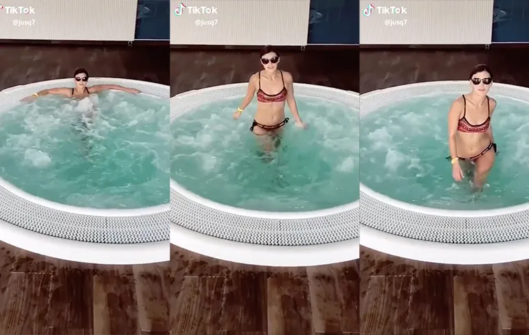 Chick probeert uitdagend uit een jacuzzi te lopen