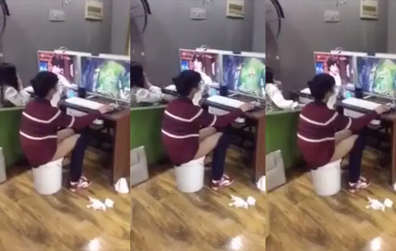 Chinees zit op emmer in een internetcafe...