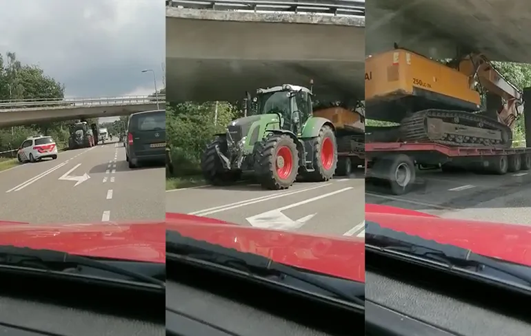 Dieplader met graafmachine vast onder viaduct bij Ommen