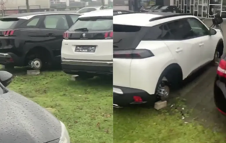 Dieven hebben wat banden geleend van auto's van een garage