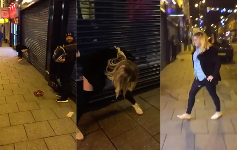 Dronken grietje doet halve koprol na afwatersessie op straat...