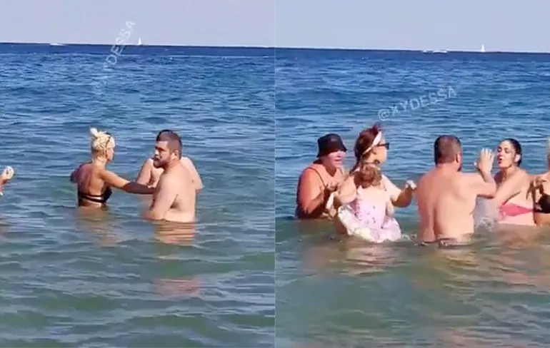 Eh, moeder van het jaar, let op je kind in plaats van matten in de zee