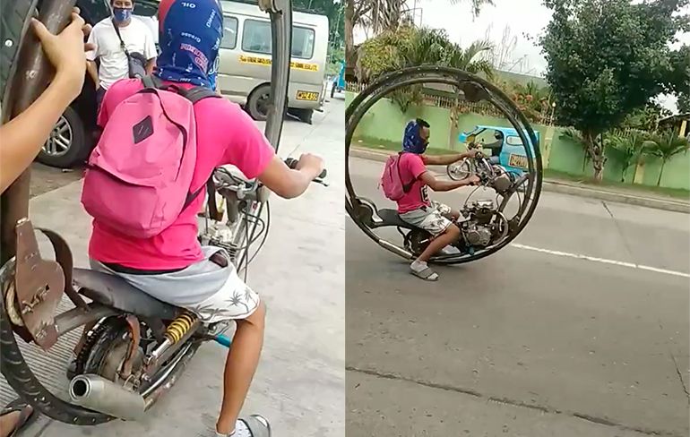 Filipijnse man heeft een motor met maar 1 wiel