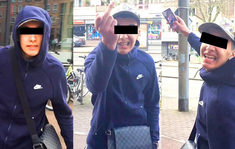 Hand in hand lopende mannen bespuugd in Amsterdam op Eerste Paasdag