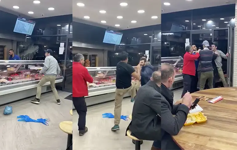 Heel veel herres in shoarmazaak, man blijft rustig zijn maaltijd eten