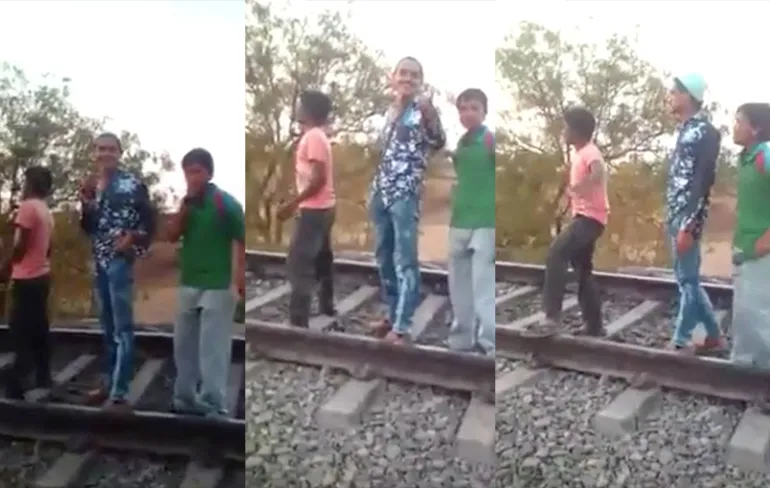 Idioten staan beetje nonchalant te kloten bij spoorrails