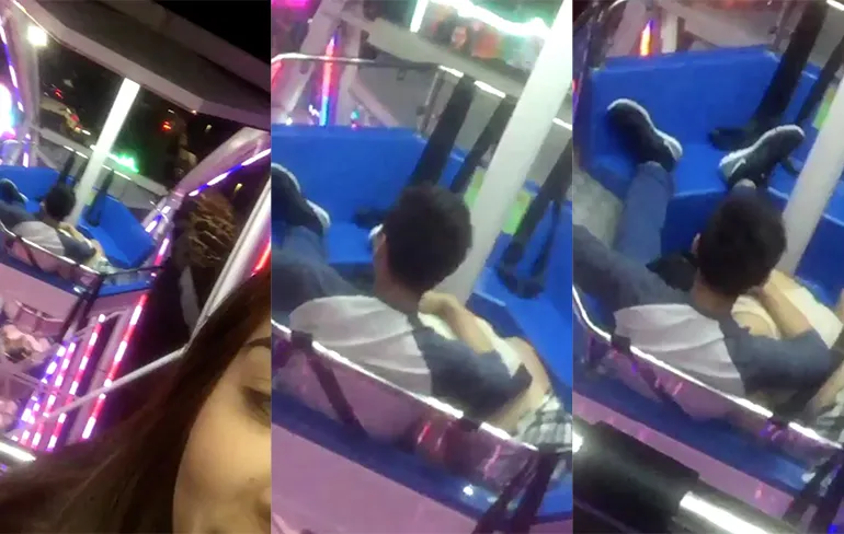 Iemand geniet extra van het uitzicht in een reuzenrad