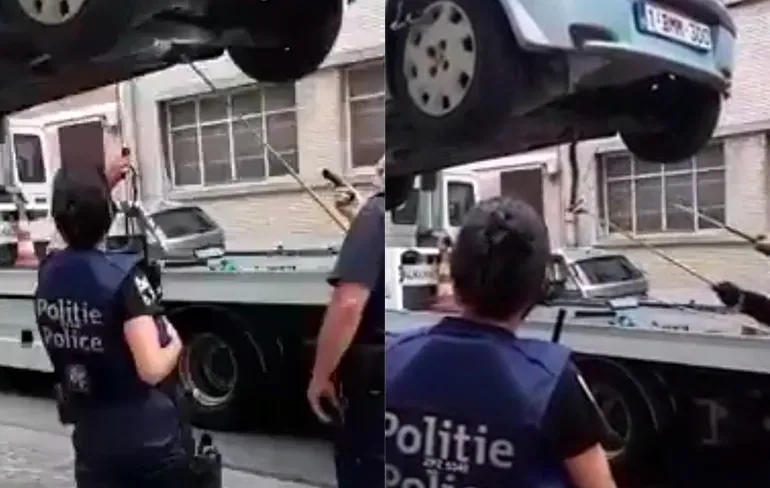 Iemand in Belgie zijn slang kwijt? Politie haalt slang onder auto vandaan