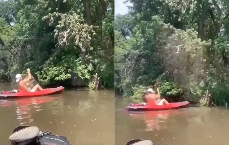 Kayakker slaat met peddel in nest van insecten