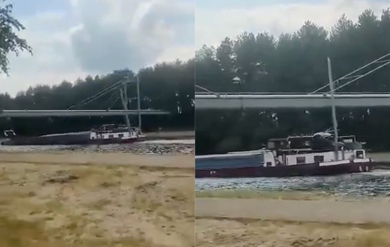 Kraan van boot in Belgie te hoog voor brug: "Ai ai ai, dat gaat krakken"
