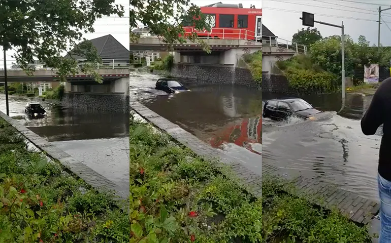 Lekker zwemmen met je auto in Hengelo na stortbui...
