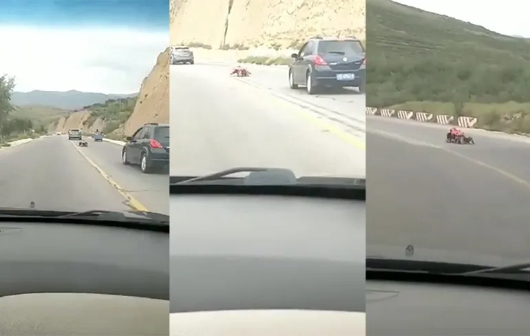 Levensgevaarlijk: Chinees gaat in rollerskate-pak van bergweg af