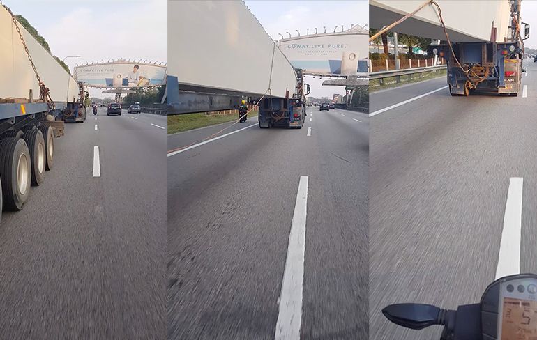 Motorrrijder in Kuala Lumpur beetje levensmoe en rijdt onder truck door