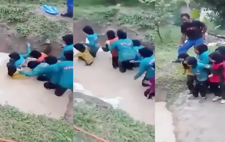 Schoolmeisjes in Maleisië wordt discipline aangeleerd in slangenkuil