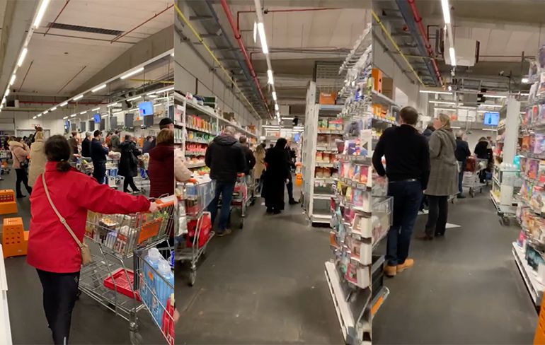 Staat een aardige rij voor de kassa van Belgische supermarkt