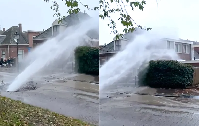 Straal van gesprongen waterleiding maakt van tuin een zwembad in Kampen