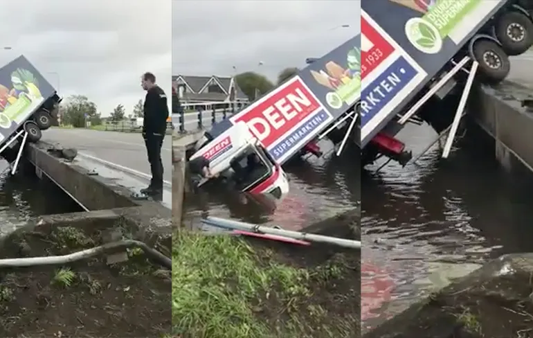 Vrachtwagen supermarkt Deen te water in Oudendijk
