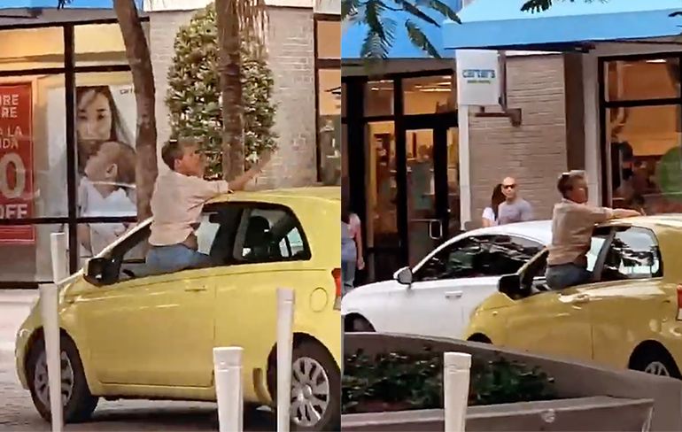 Vrouw hangt uit auto om vinger op te steken, botst tegen geparkeerde auto