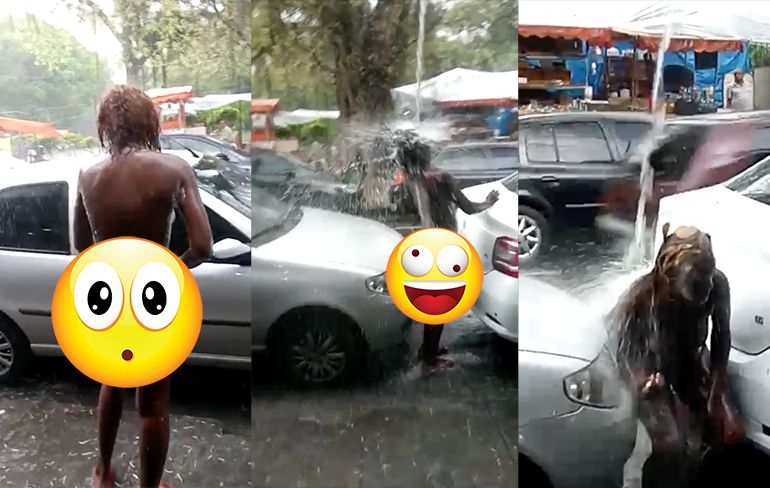 Vrouw onder invloed neemt douche in de regen in Sao Paulo