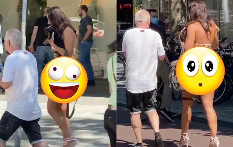 Vrouw wel heel erg luchtig verkleed tijdens mondkapjes demonstratie in Rotterdam