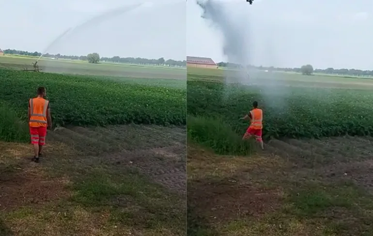 Vuilnisman wil afkoelen onder watersproeier