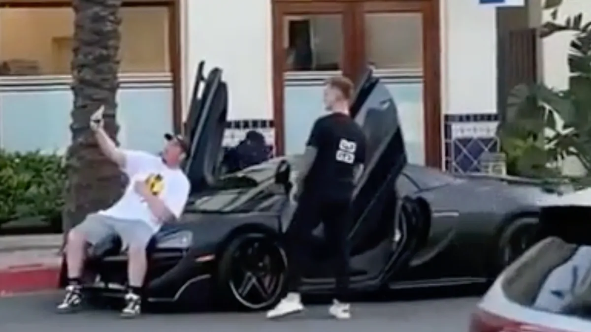 Note to self: niet zat op de motorkap van andermans McLaren gaan liggen