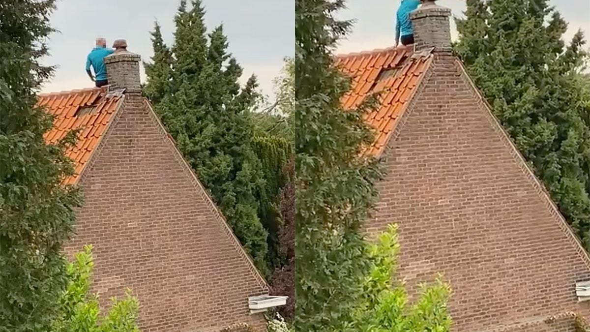 Man in Arnhem klimt op dak en gooit gezellig dakpannen naar beneden