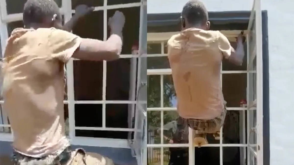 Man klimt door heel klein raampje een huis binnen