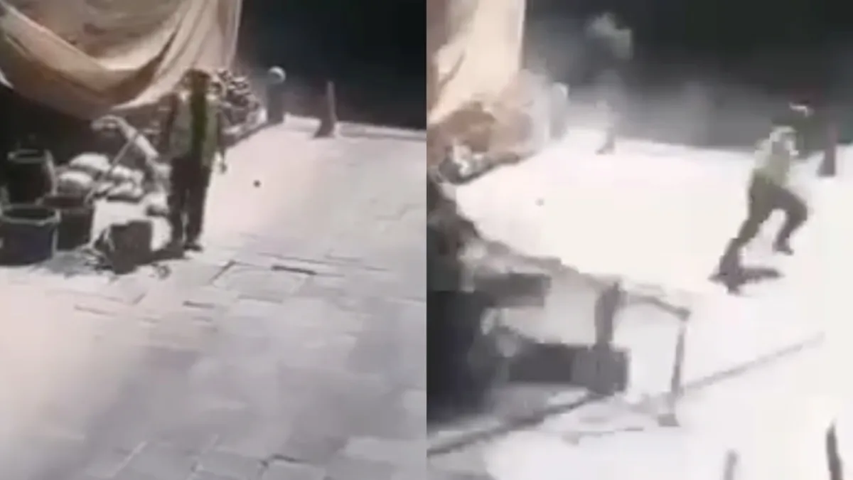 Oplettende bouwvakker kruipt door oog van de naald na instorten steiger in Moskou