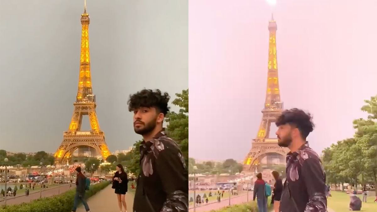Sta je te poseren voor een foto, slaat de bliksem in op de Eiffeltoren