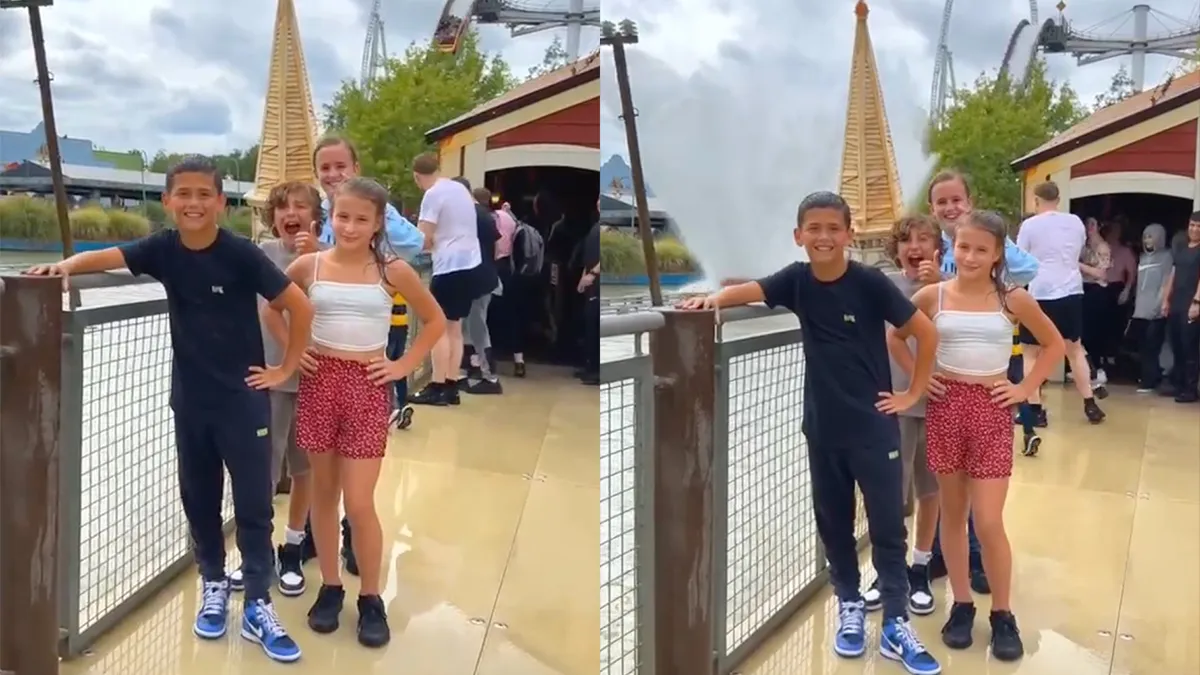 Papa weet goede plek om foto te maken in pretpark en neemt kinderen te grazen