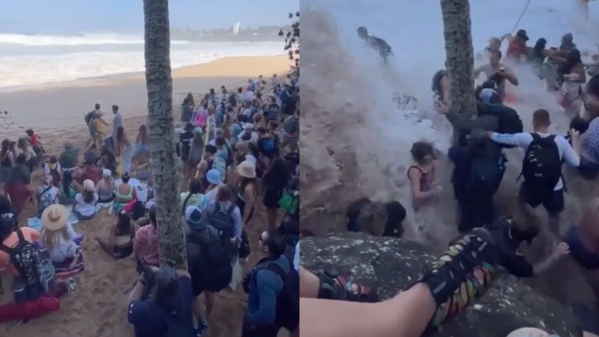 Publiek massaal nat pak tijdens surfwedstrijd Hawaii