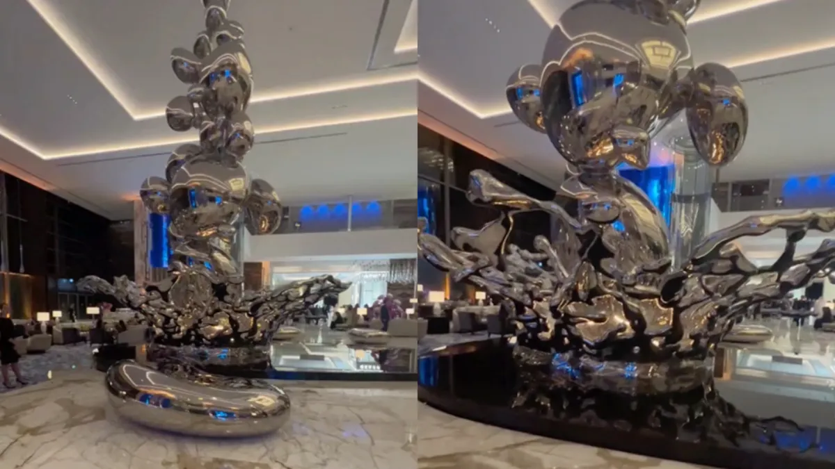 Dame loopt nat pak op tijdens vastleggen van kunstwerk in Atlantis The Royal