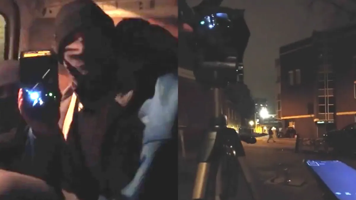 Video laat zien hoe gemaskerde mannen racistische teksten projecteerden op stadhuis Eindhoven