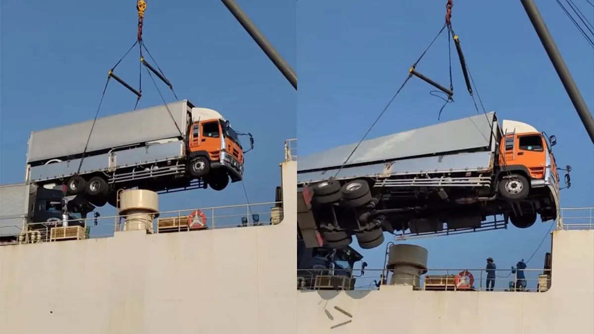 Kabel schiet los en aan boord hijsen van vrachtwagen gaat fout