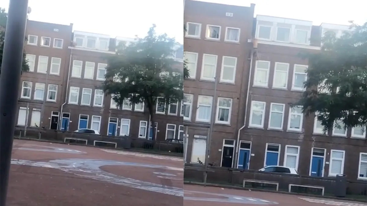 Man klimt van regenpijp naar beneden, maar valt de laatste meters