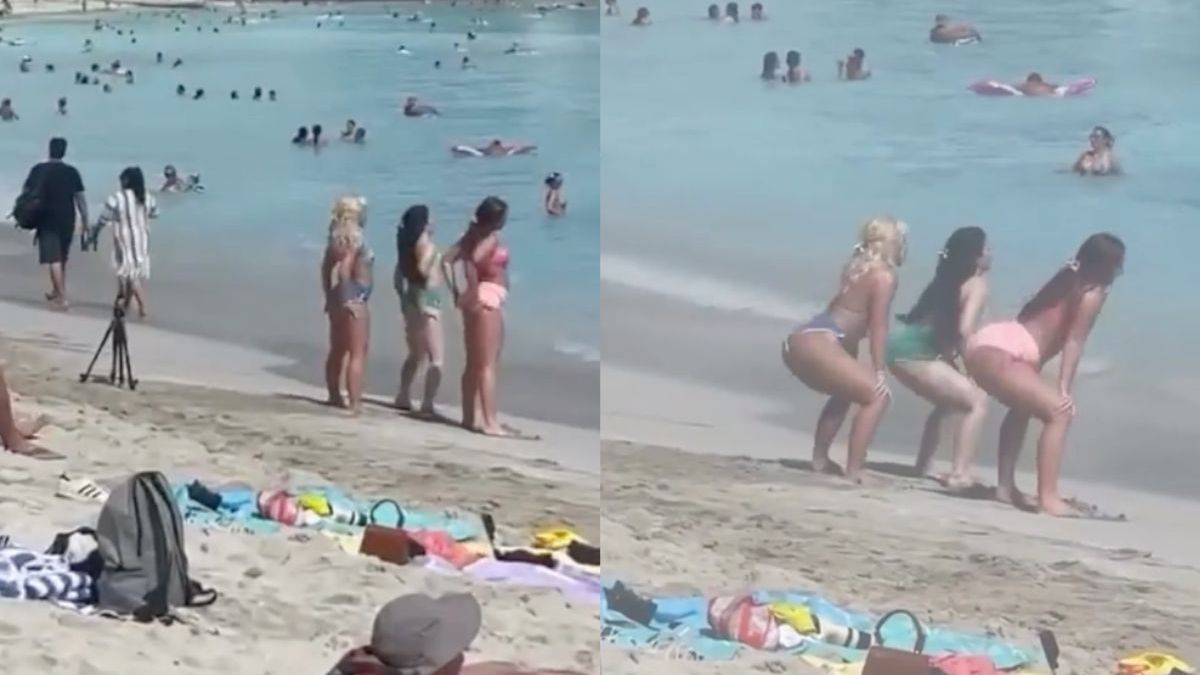 Dansende dames trekken zich niets aan van de overige aanwezigen op Waikiki Beach